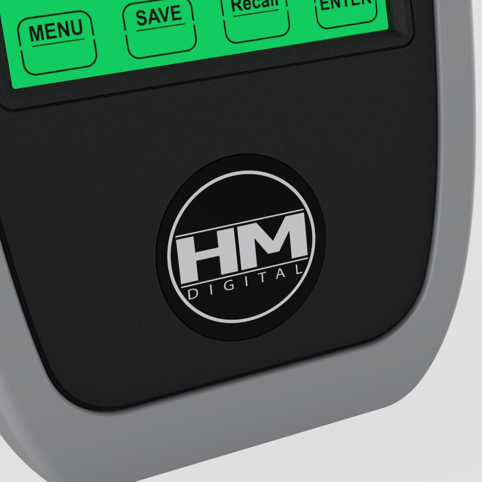 Circular HM Digital badge on the HM-500 textured black fascia, surrounded by a gray silicone sleeve.